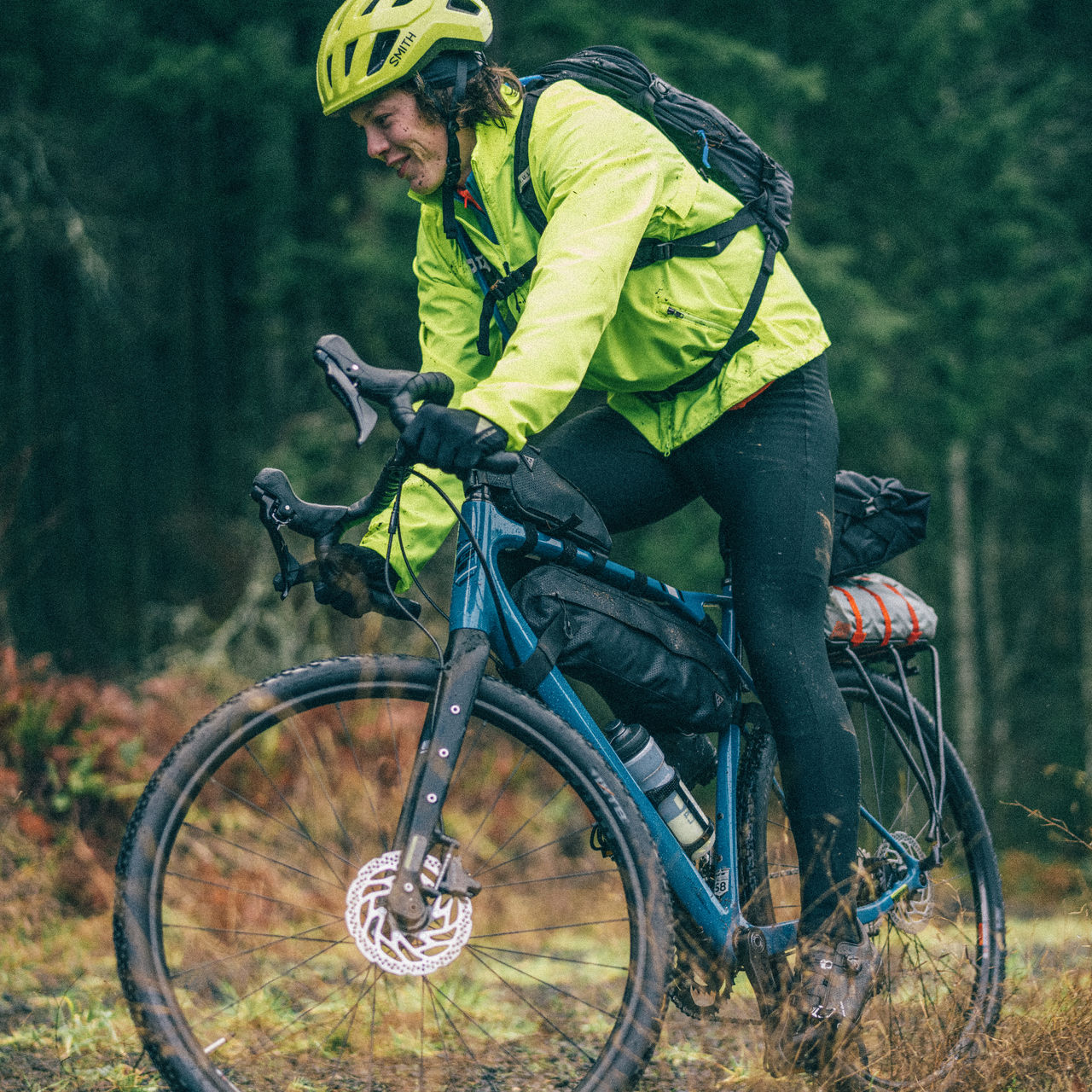 A man bikepacks in the forestBike packing bicycle in a forest