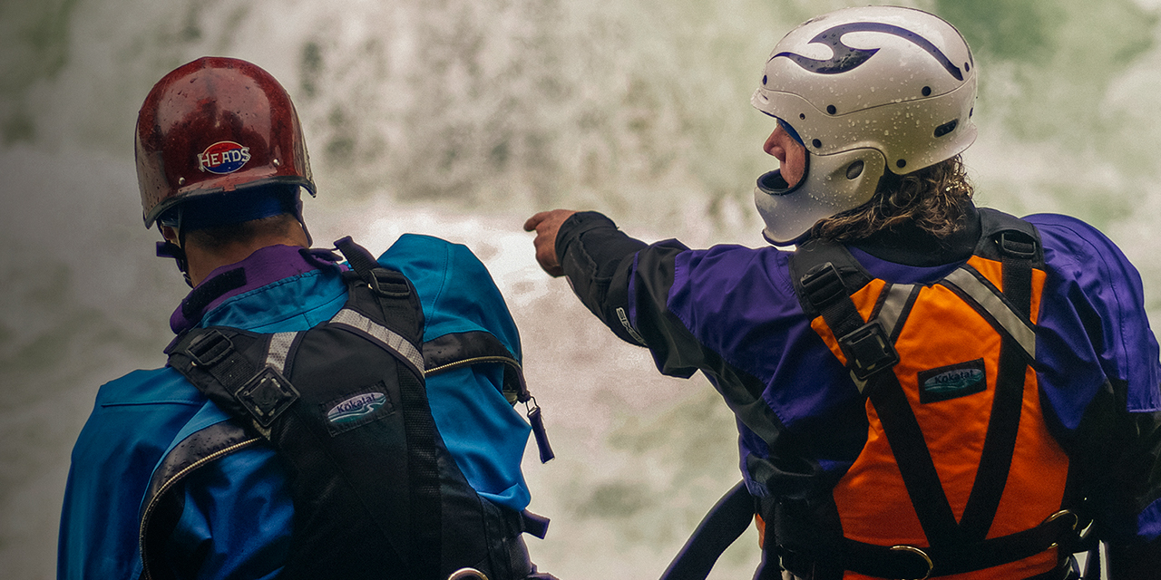 Two men scouting a rapid on the Salmon River, near Forks of Salmon, California.
