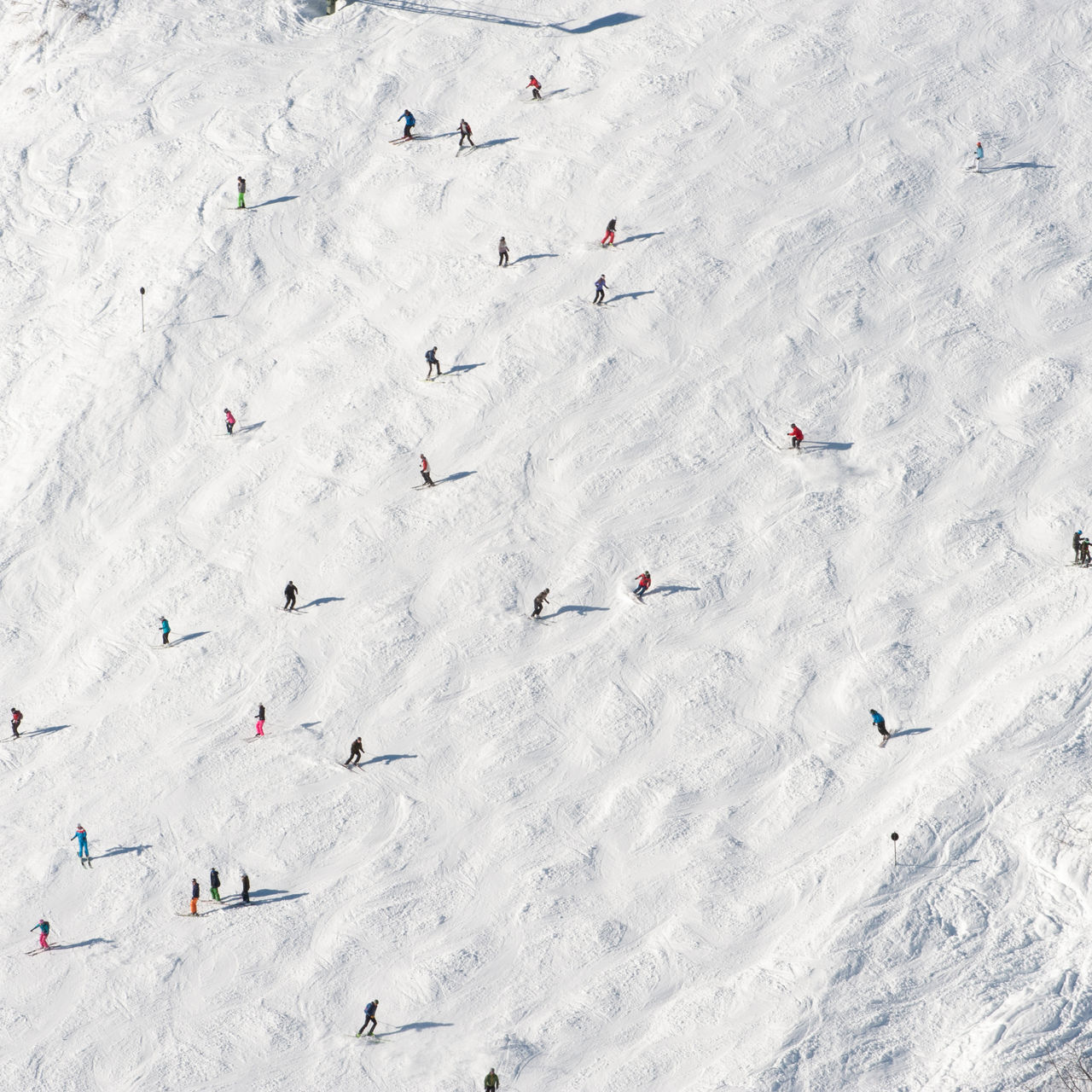 skiers on a ski slope in the distance