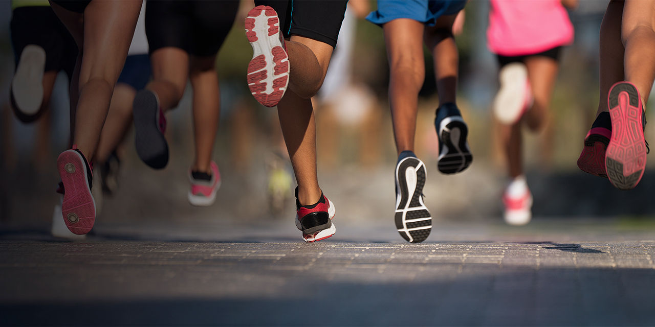 A detail of shoes running together
