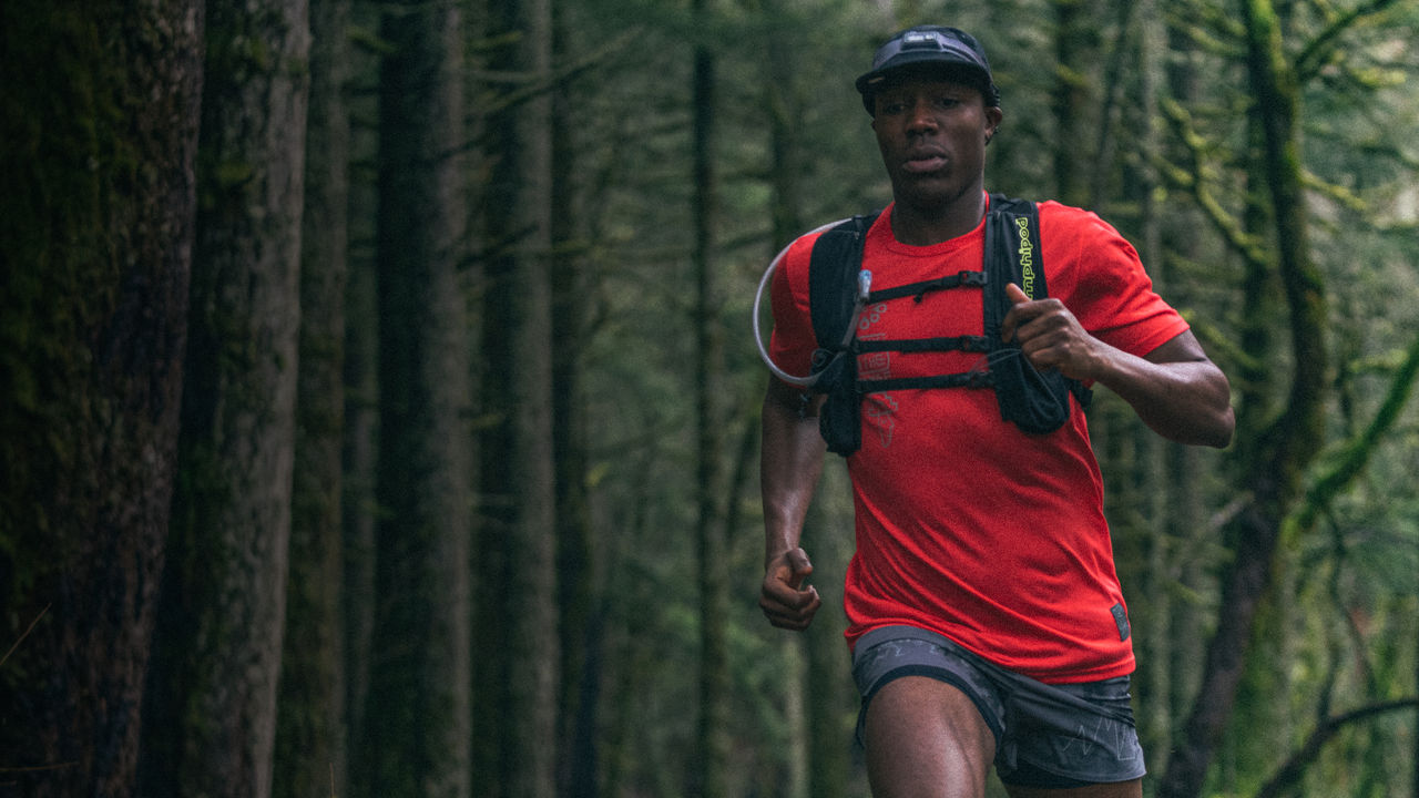 A man runs in the forest