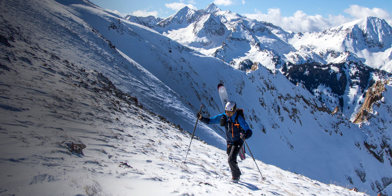 Aidan Goldie walks up a mountain