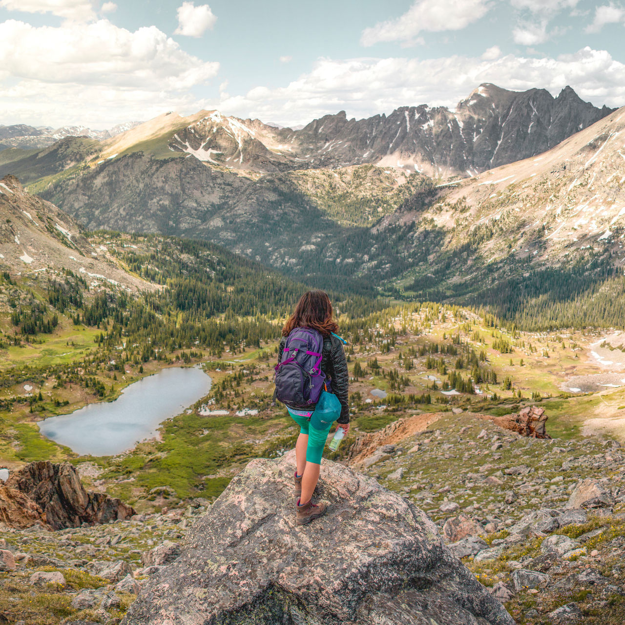 Woman standing on a mountain in high altitude