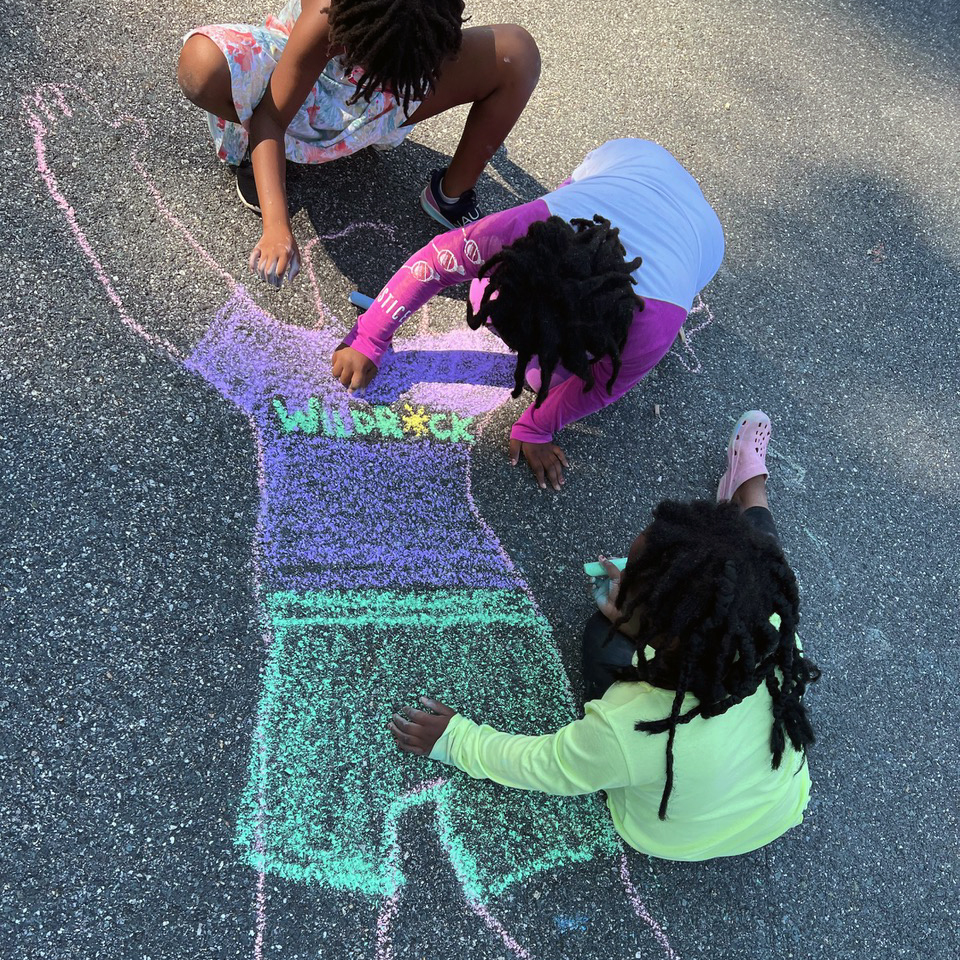 Children play with chalk at WIldrock