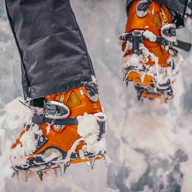 The boots and crampons of an ice climber.