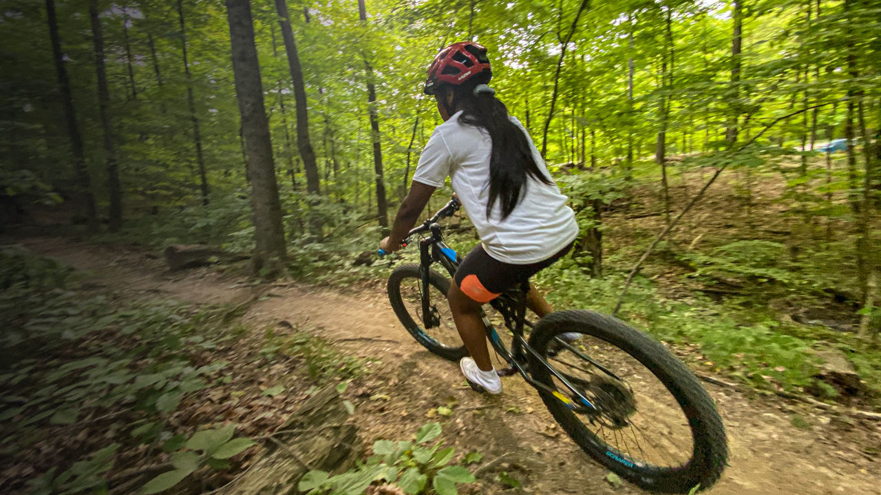 A mountain biker rides a trail in Alum Creek SP