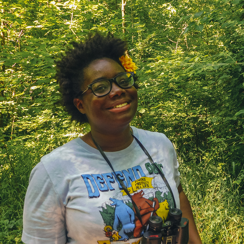 Nicole Jackson poses while birdwatching