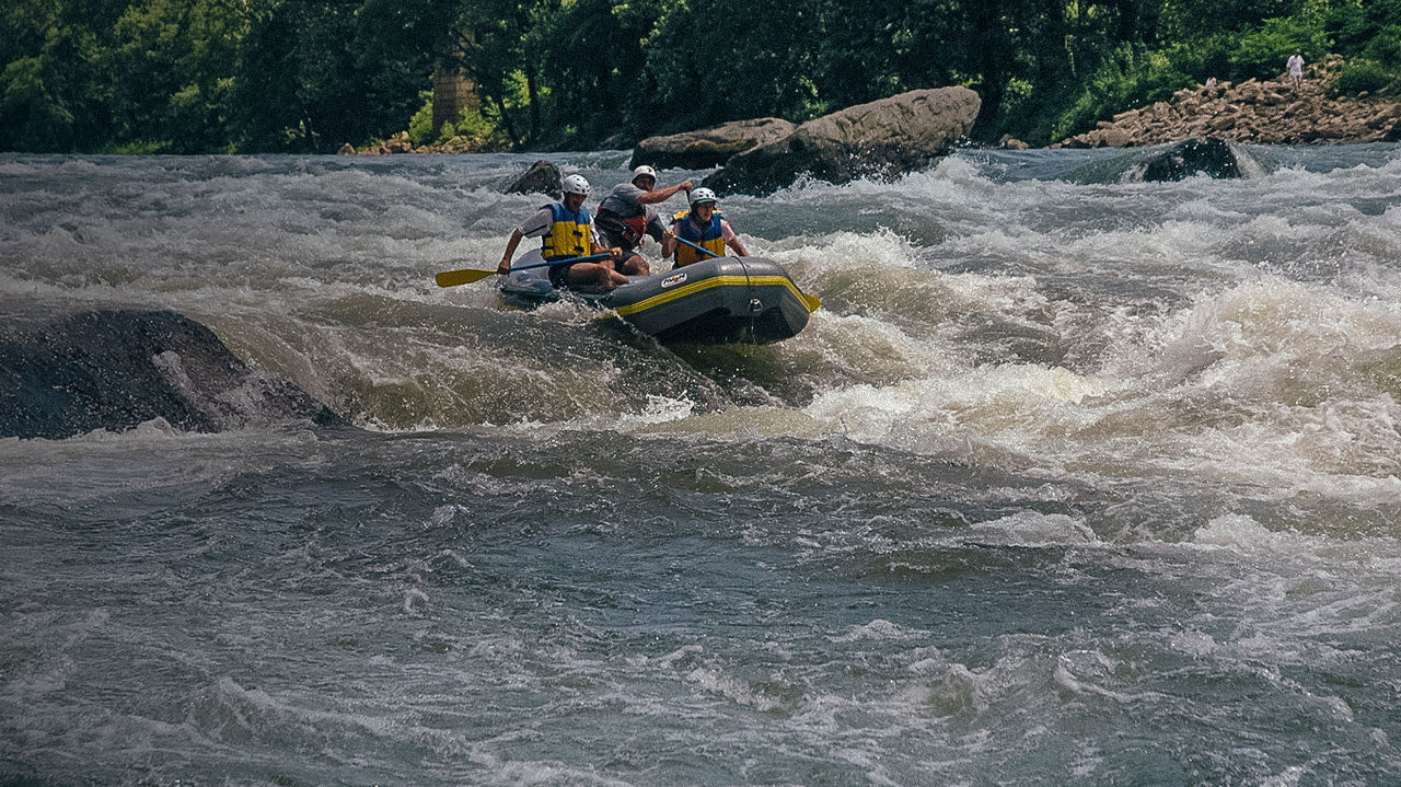 Rafters paddle past Fayette Station Bridge