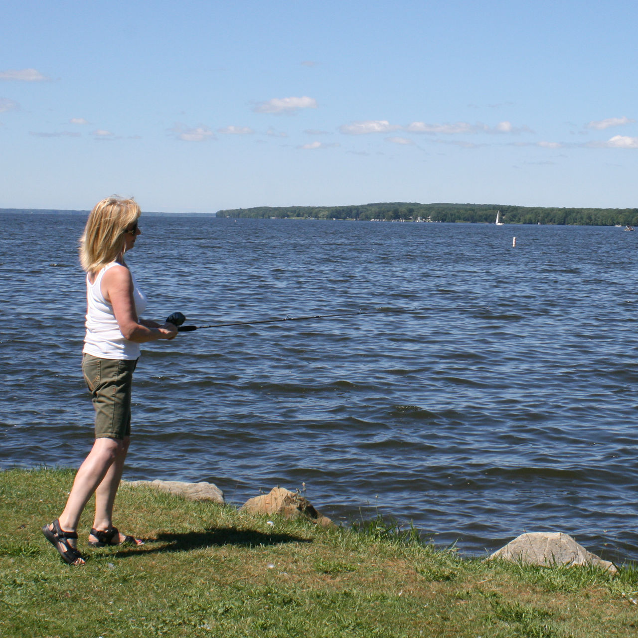 A woman fishes at Pymatuning