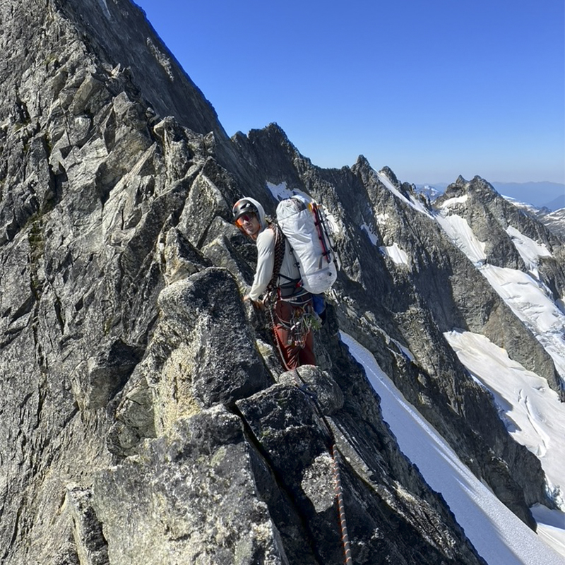 Josh Jespersen climbs a mountain in the snow