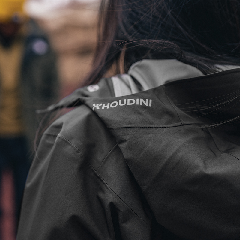 A woman wearing a black jacket.