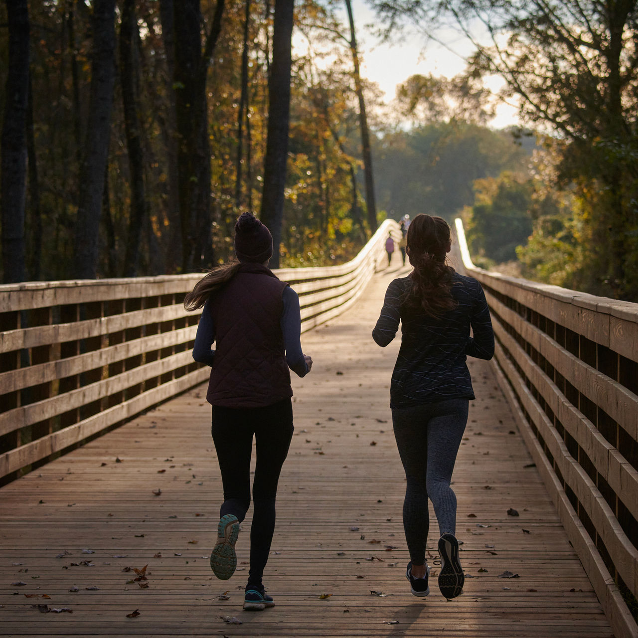 A silhouette of runners on Atlanta’s Silver Comet