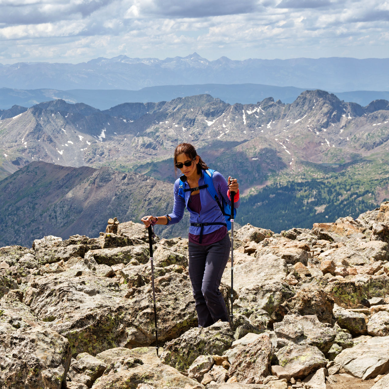 A woman hikes in the high alpine