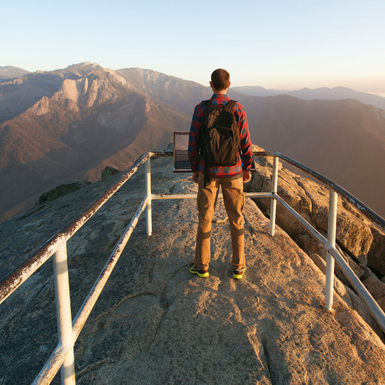 Man hiking in Sequoia National Park, enjoying view Moro Rock, California