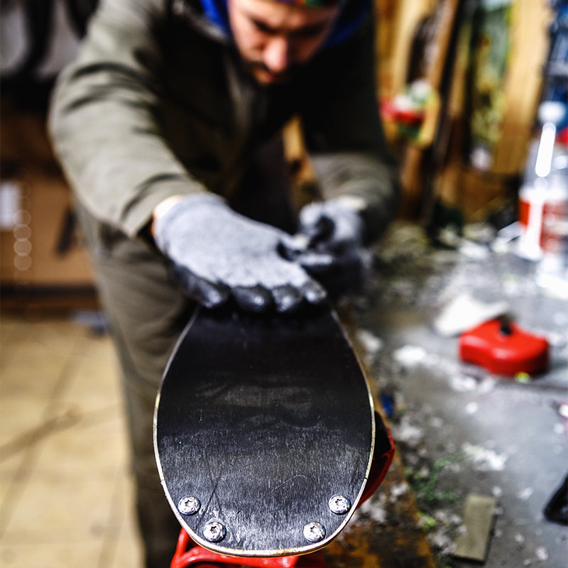 Waxing skis in a workshop
