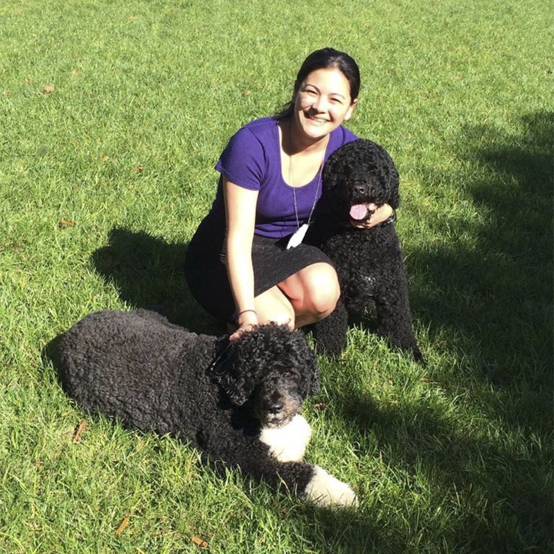 A portrait of Molly Kawahata with her dogs