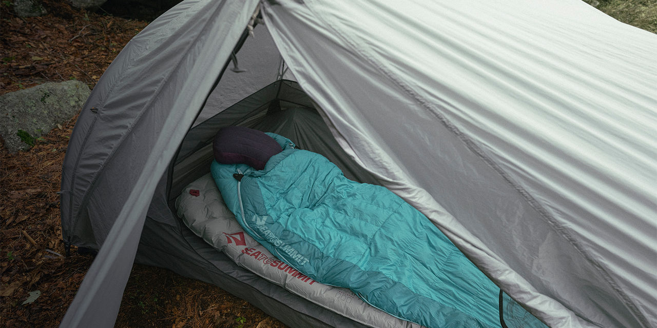 A sleeping bag in a tent