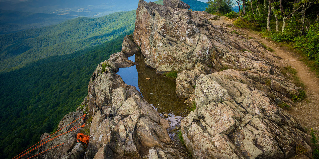 Rock climbing ropes attached to rocks on Little Stony Man Cliffs, in Shenandoah National Park, Virginia.