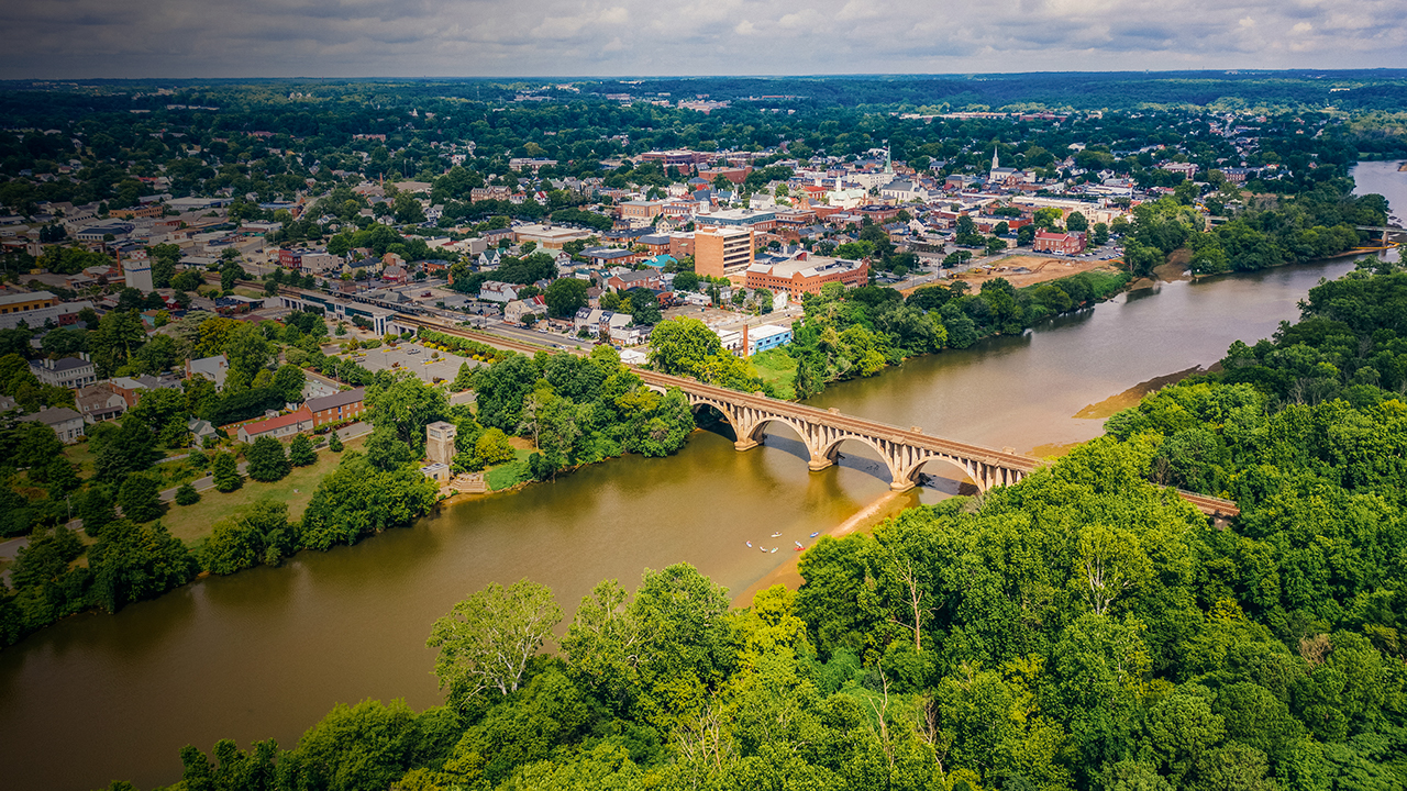 Aerial view of Fredericksburg Virginia from across the Rappahannock River with kayaks on the water