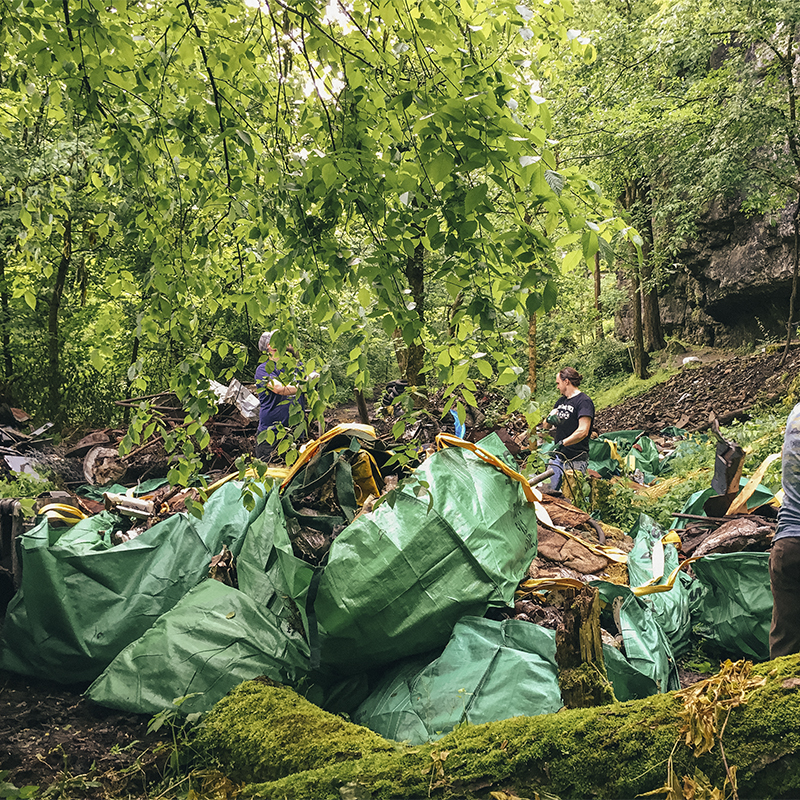 Volunteers clean up trash around the Mad Giver Gorge