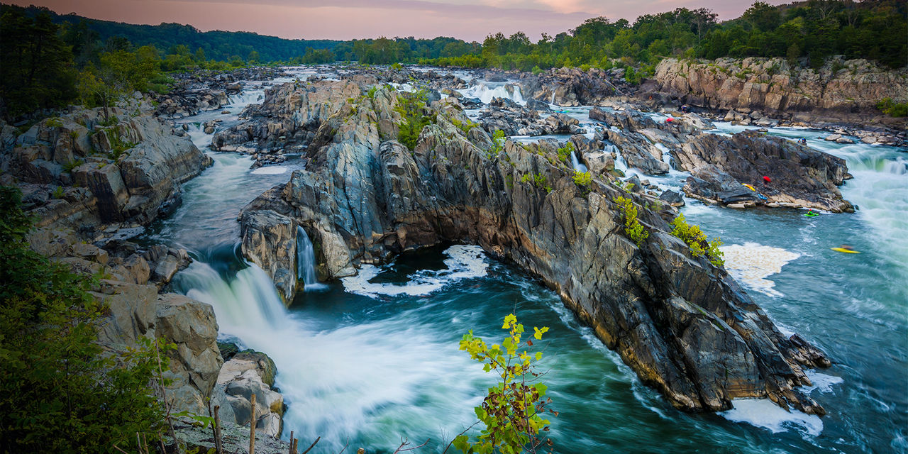 View of rapids in the Potomac River at sunset, at Great Falls Park, Virginia.