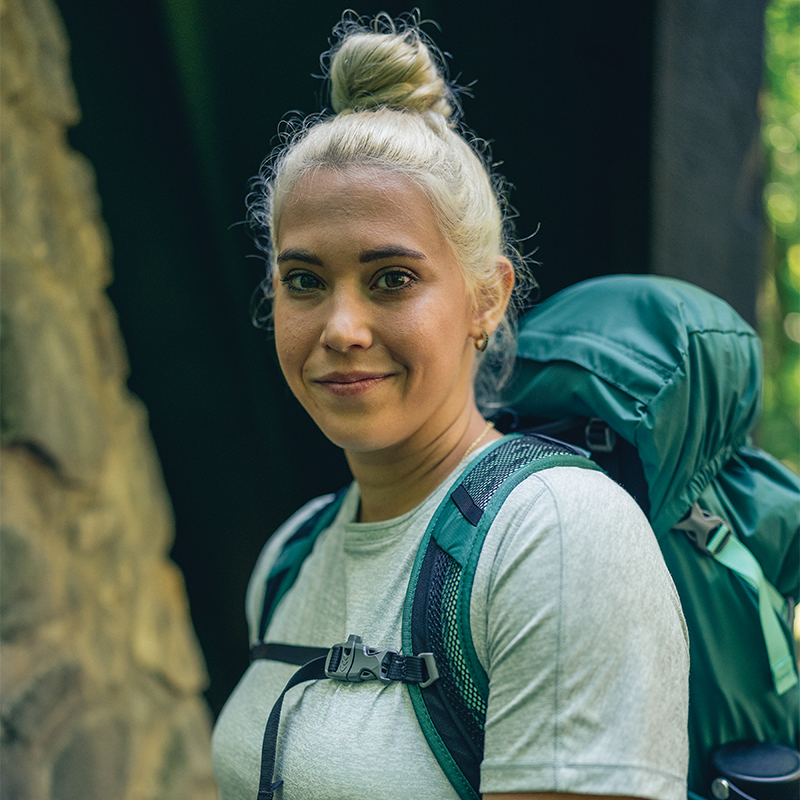 Female hiker wearing a backpacking pack