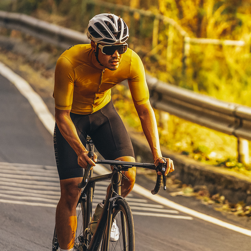 A man rides his bike uphill