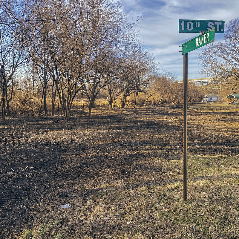 Future Valentine Conservation Community park site  landscape with a tree grass and mud