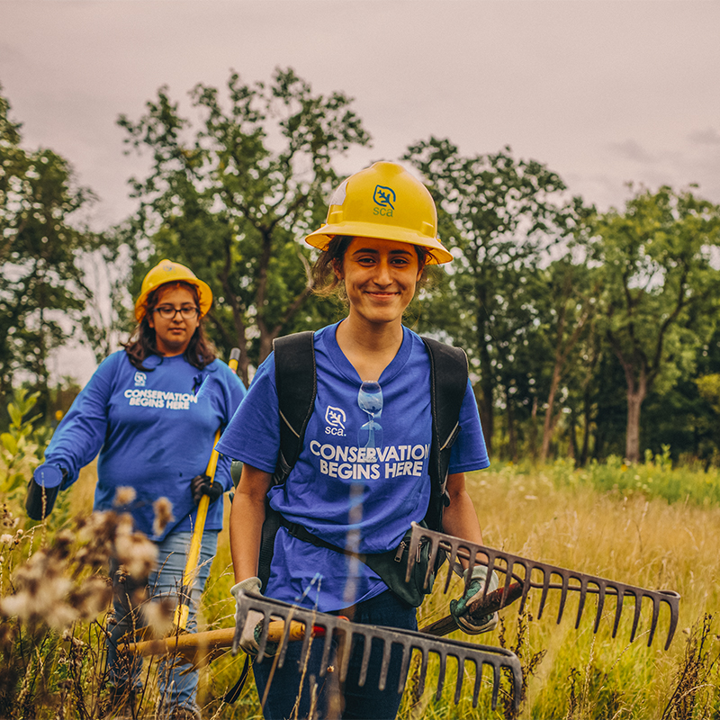 Students walking with tools