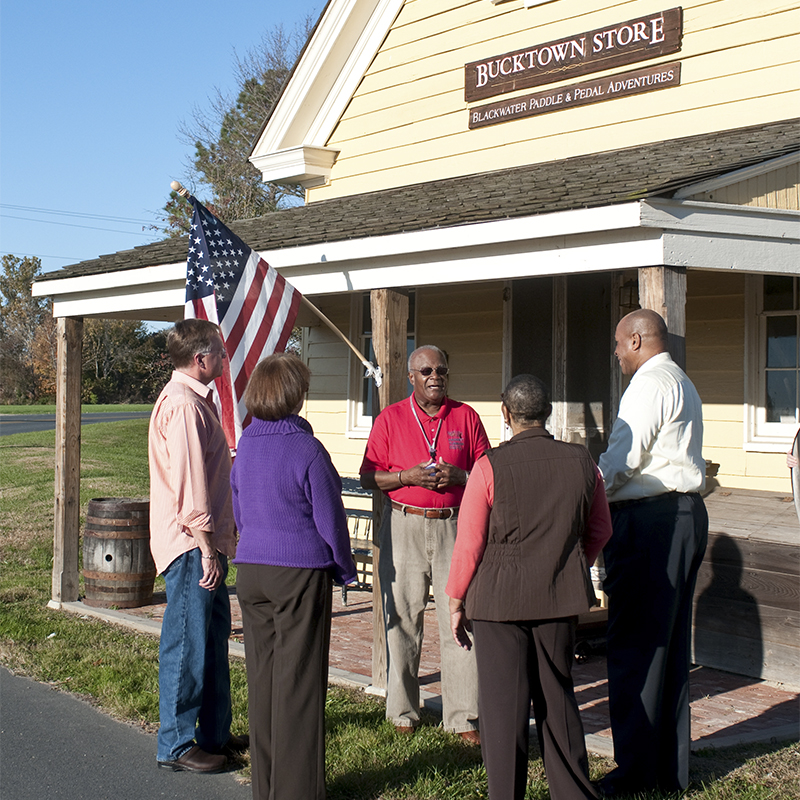 Visitors congregate outside of the Bucktown store in Harriet Tubman Underground Railroad National Historical Park